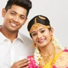 Smiling South Indian newlywed couple
